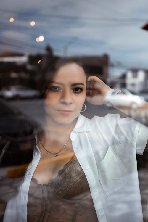 Woman Posing behind Window
