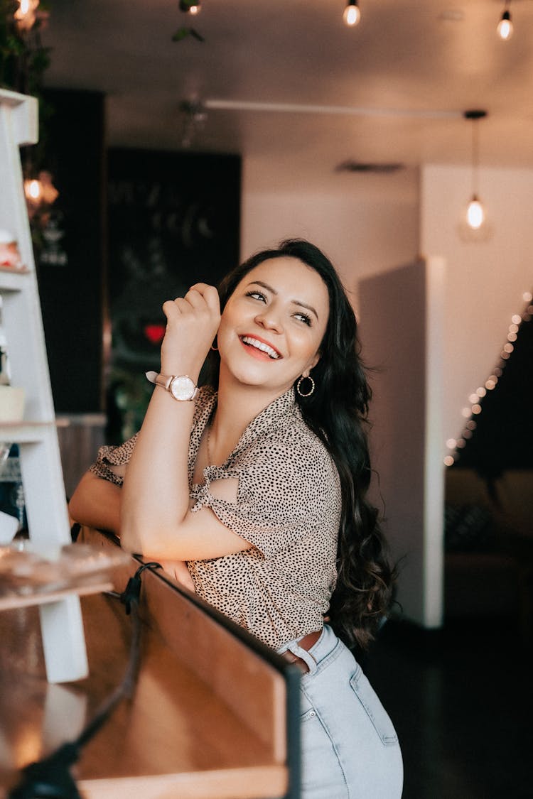 Smiling Woman Leaning On A Counter