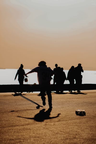 Silhouetted skateboarder at sunset, photo by Dogu Tuncer on Pexels