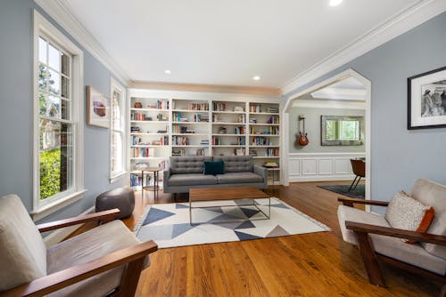 Sofa, Armchairs and Bookshelf in Room