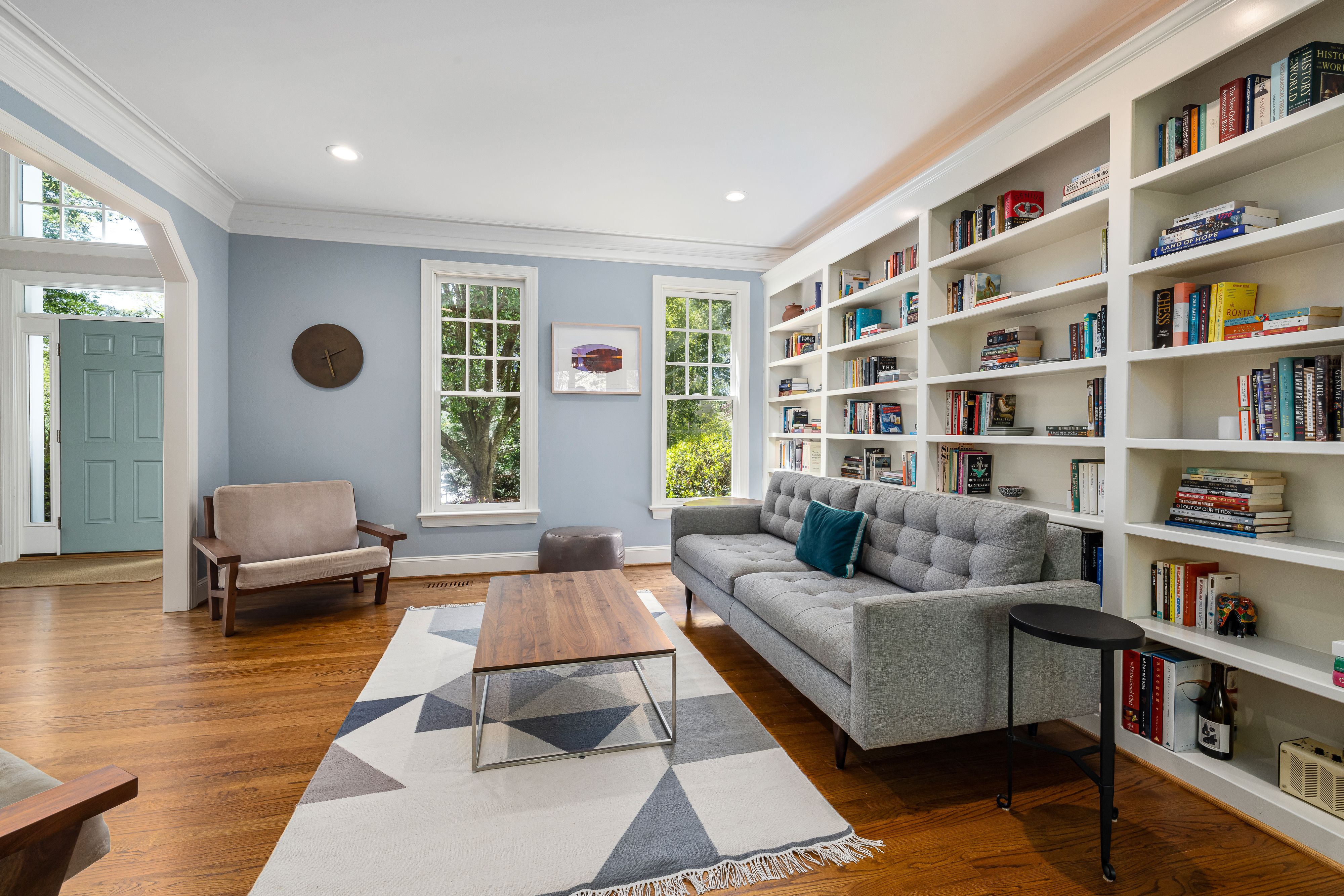 well-organized bookshelf styled for staging - occupied staging consultation