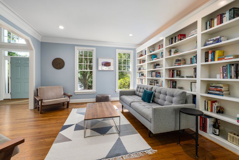 well-organized bookshelf styled for staging - occupied staging consultation