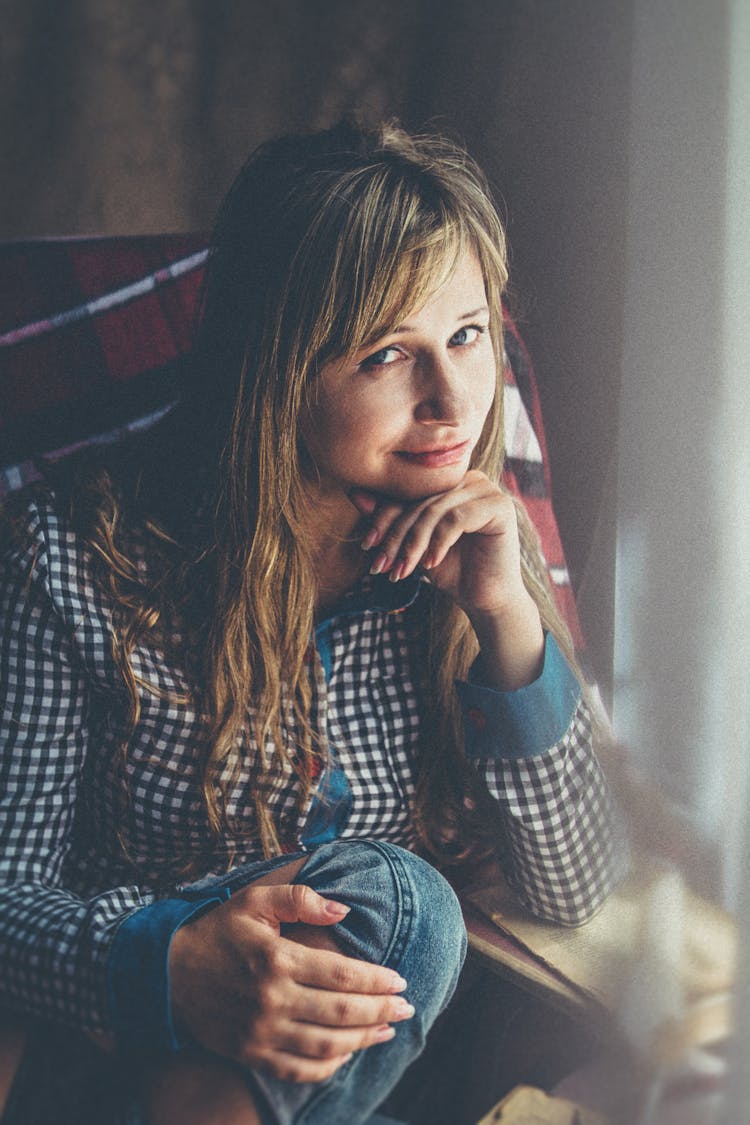 Photo Of A Woman Holding Her Chin