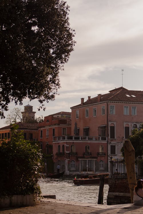 View of a Pavement, Part of the Canal and Apartment Buildings in Venice, Italy