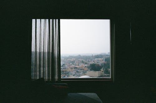 Free View of a City from a Window of a High Floor Apartment  Stock Photo