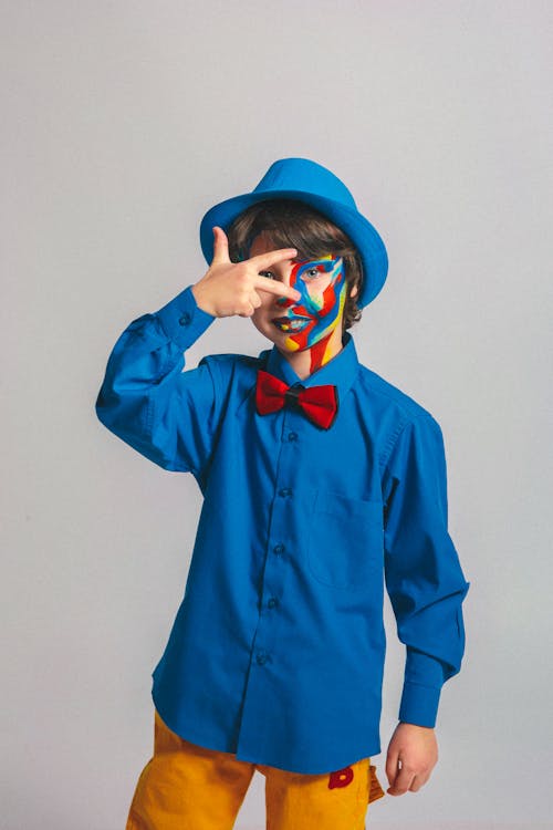 Boy With Face Paint Posing For Photo