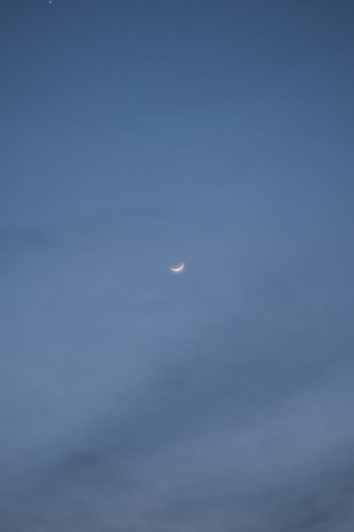 A Crescent Moon on Clear Sky 