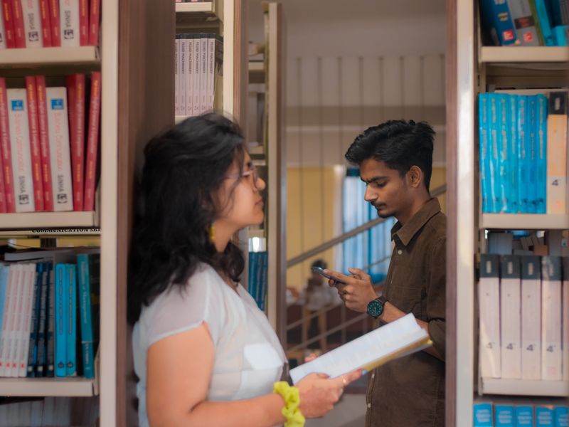 Indian college students studying in a library in New Delhi
