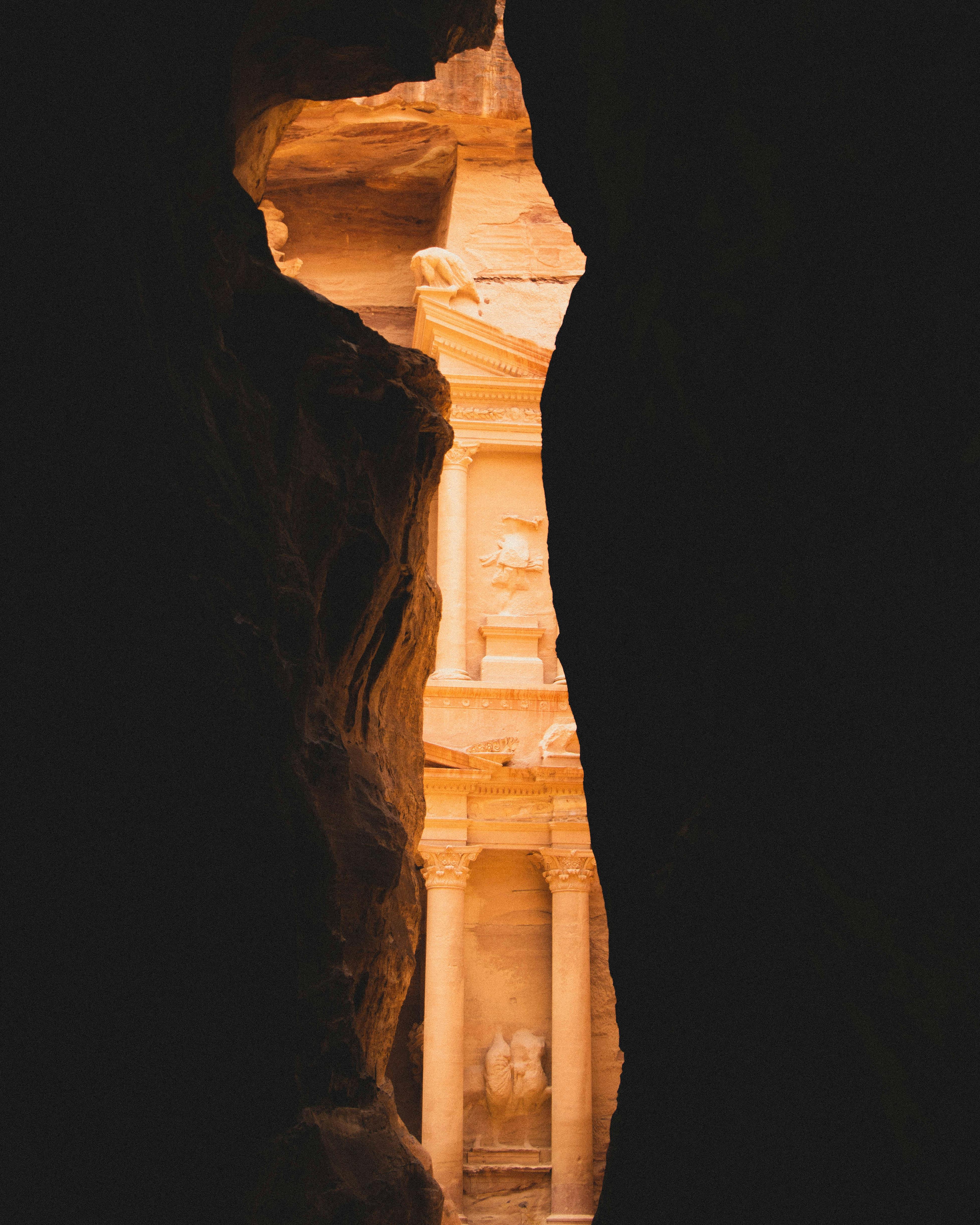 The Al-Khazneh Treasury glimpsed through the Siq gorge in Petra, Jordan.