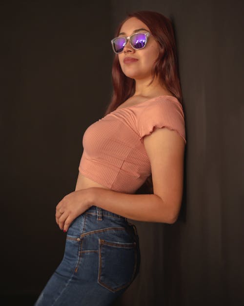 Model in a Pink Crop Top and Jeans
