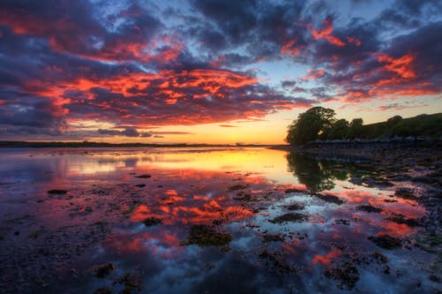 Glass Body of Water and Clouds