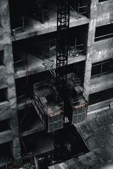 High angle view of elevators in an abandoned urban building, showcasing decay.