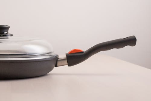 Close-up of a Frying Pan with a Glass Lid 