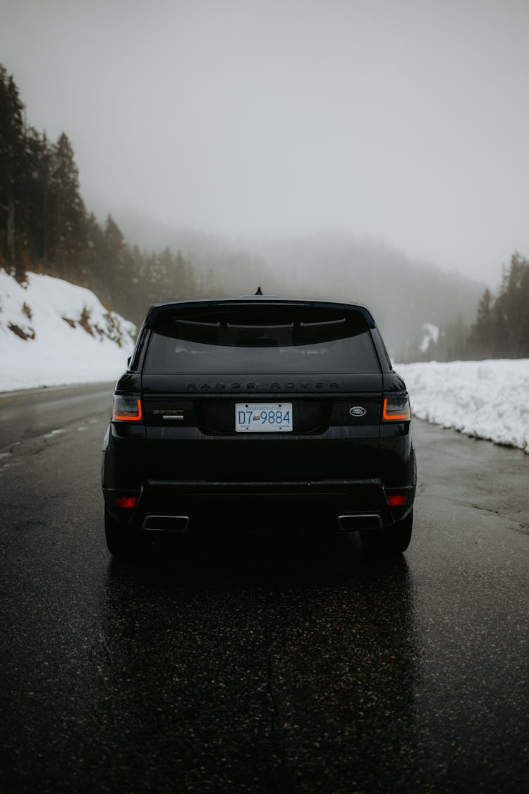 SUV Car On The Road In Winter 