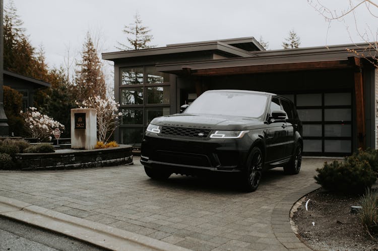 Black SUV Car Parked In The Driveway