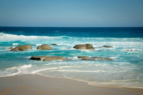 Free Pristine beach view with boulders and clear turquoise waves near Albany, Western Australia. Stock Photo