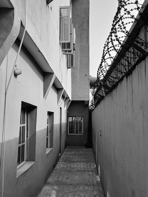 Narrow Alley with Barbed Wire