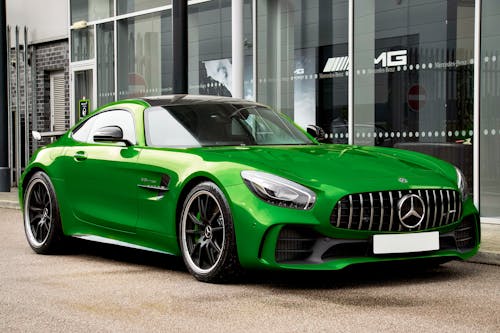 View of a Green Mercedes-AMG GT R Parked in front of a Car Salon 