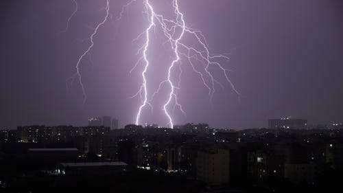 View of Lightning Strikes above a City 
