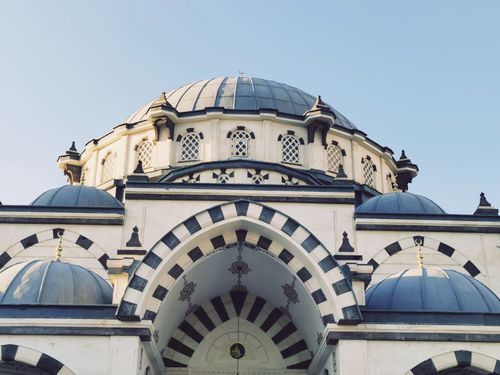 Free Explore the intricate architecture of Eruslu Mosque in Gaziantep with its mesmerizing domes and clear sky. Stock Photo
