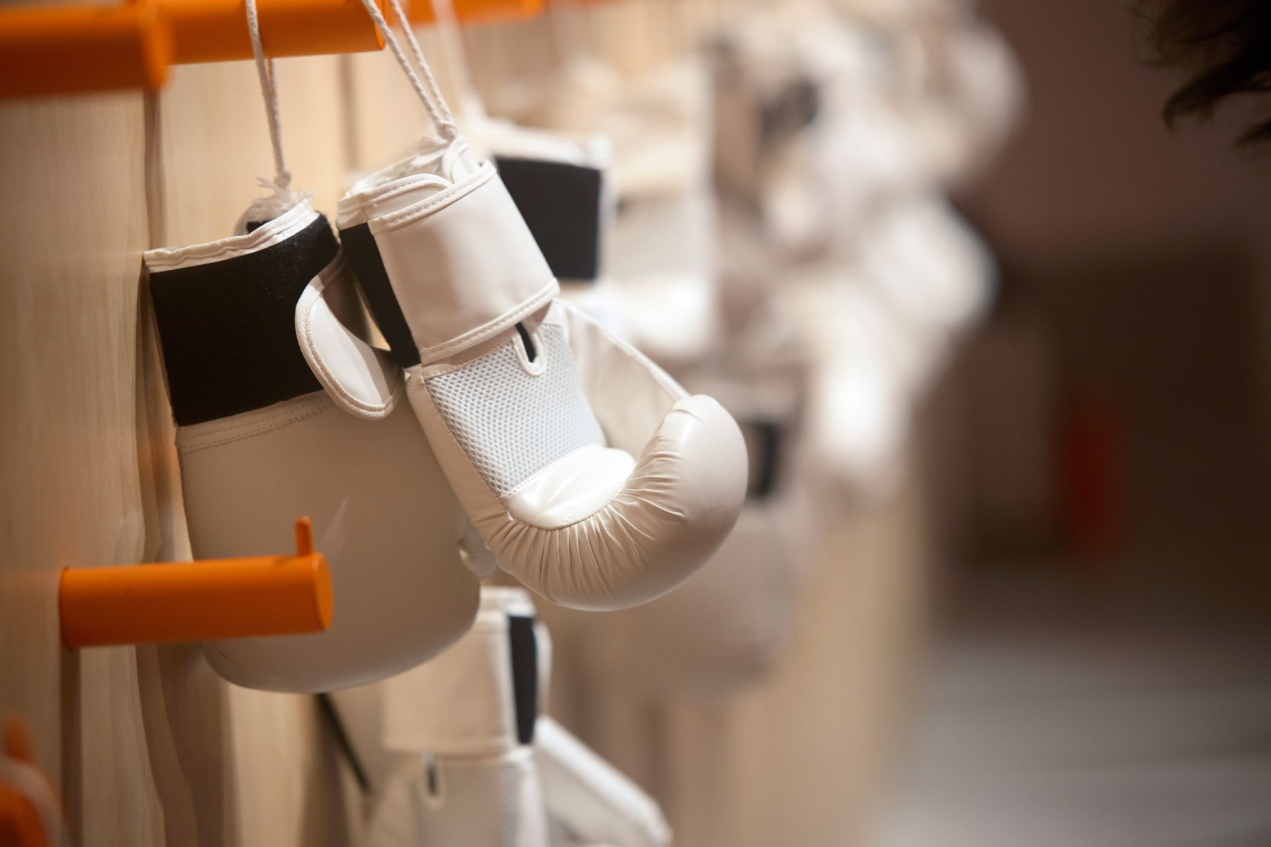 Vanguard Pro boxing glove — premium navy leather with orange stitching