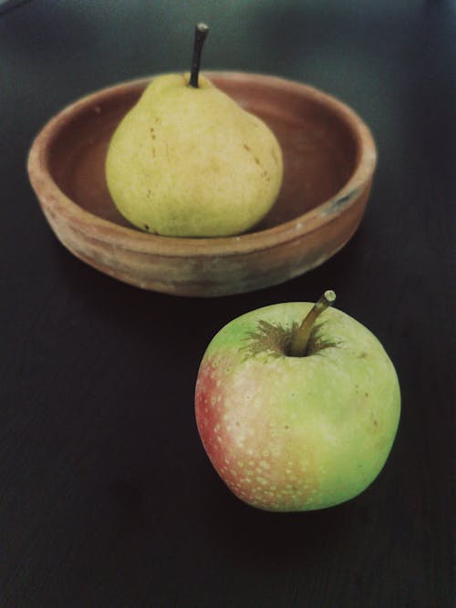 Fresh Apple and Pear on Table