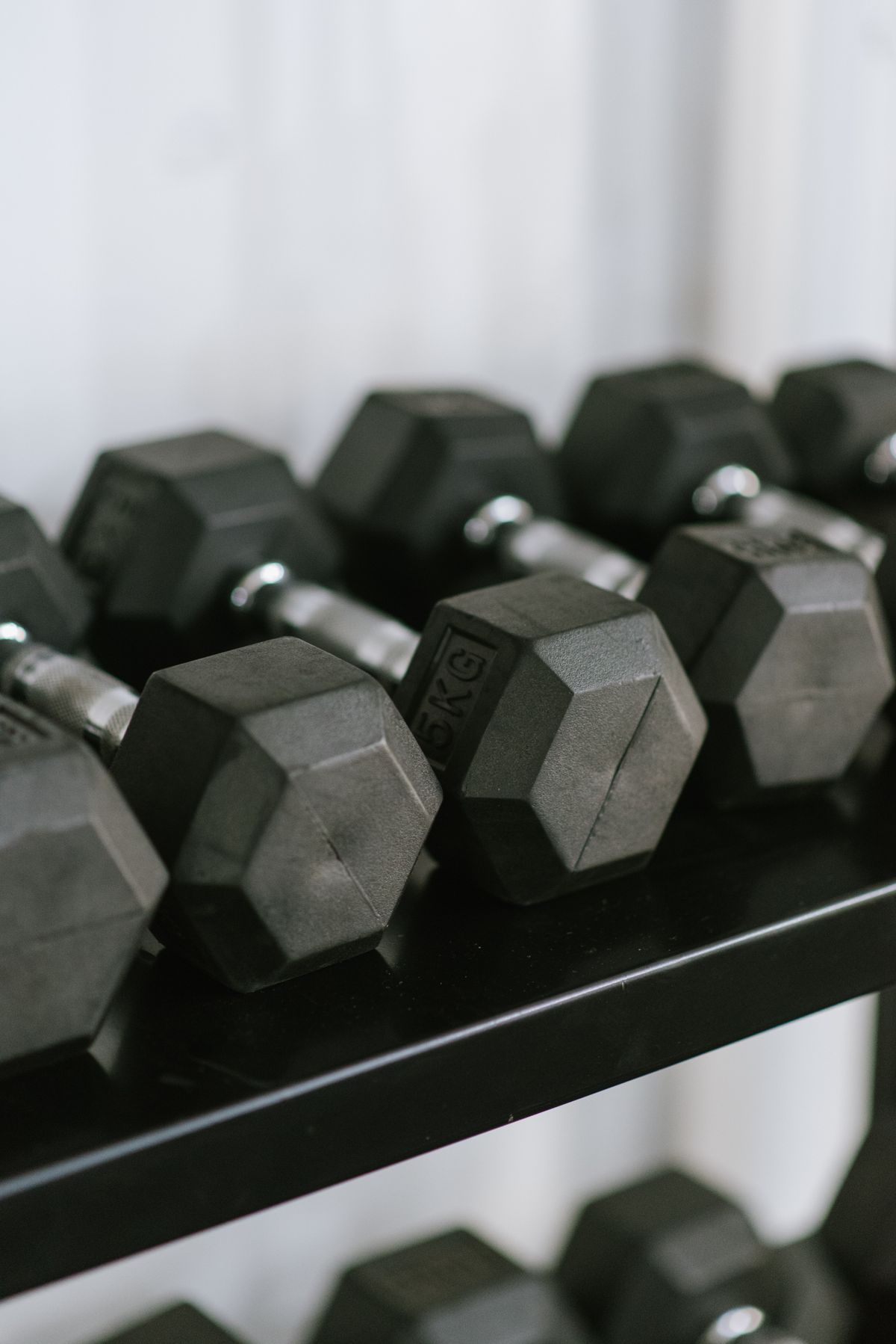 Hex dumbbells arranged on a gym rack for strength training
