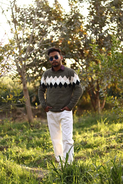 Man with Sunglasses Posing in Sweater in Park