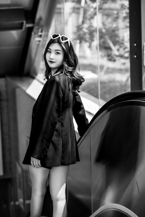 Beautiful Woman in Coat Posing on Escalator