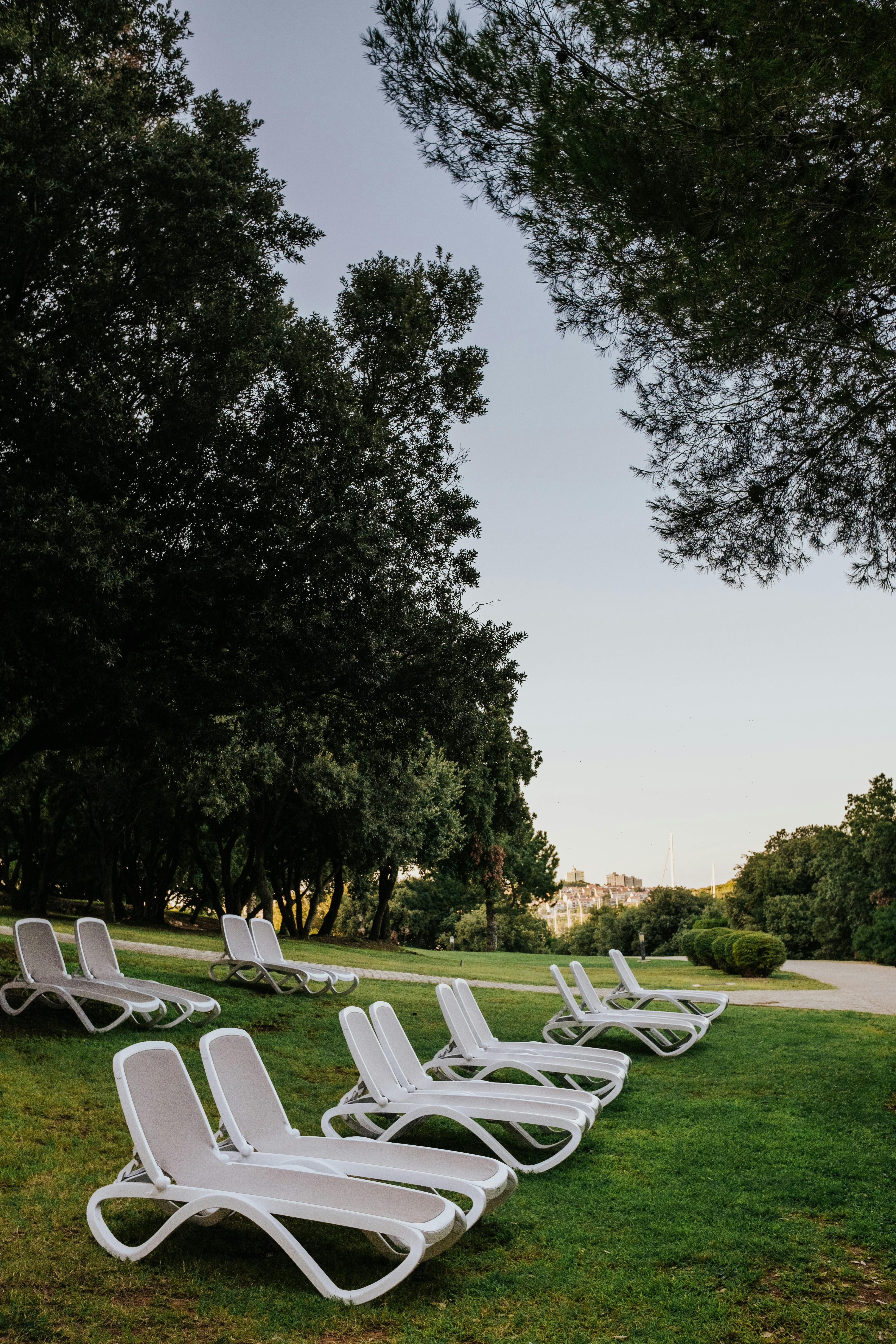 Outdoor seating area with greenery and water feature