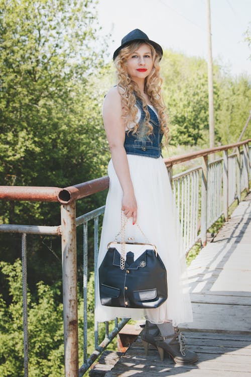 Woman in Denim and White Dress