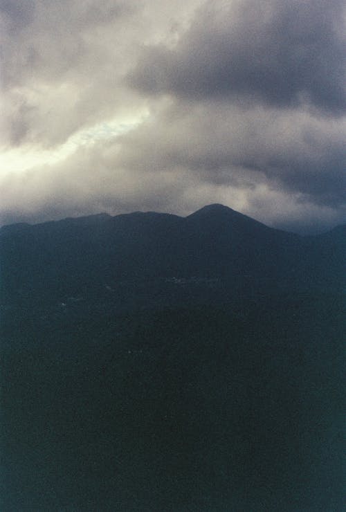 Silhouette of Mountains under a Storm Cloud 