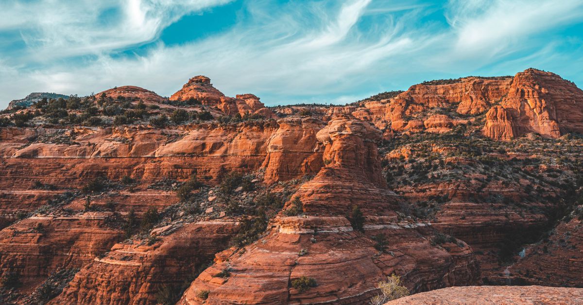 Vibrant Sedona red rock formations under a clear blue sky, showcasing natural beauty.