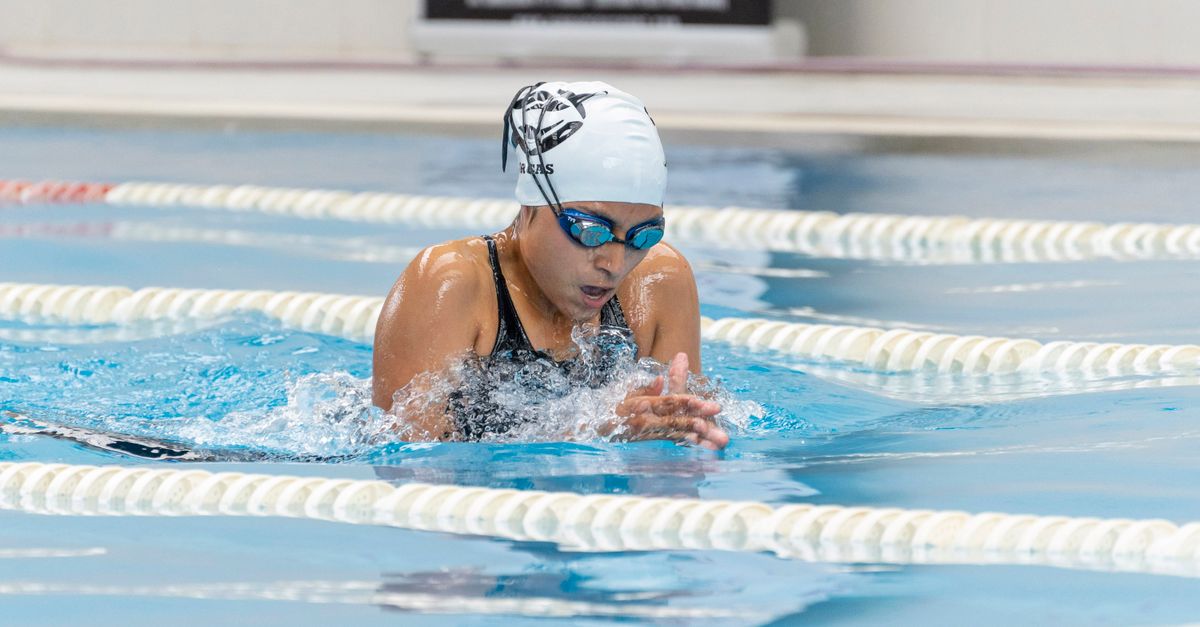 Swimming: Regan Smith sweeps 200 IM and 50 fly at Austin Sectionals as Northampton naturist session cancelled Adult woman swimming breaststroke during competition in indoor pool.