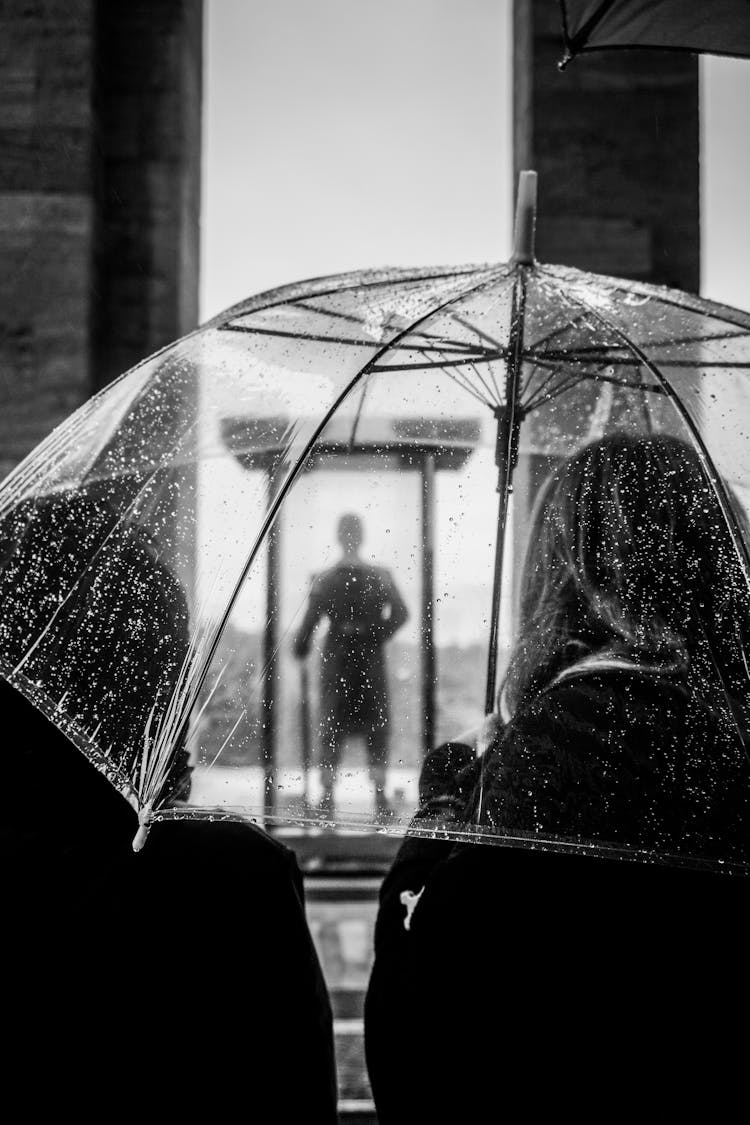 View On A Persons Silhouette Through A Transparent Umbrella