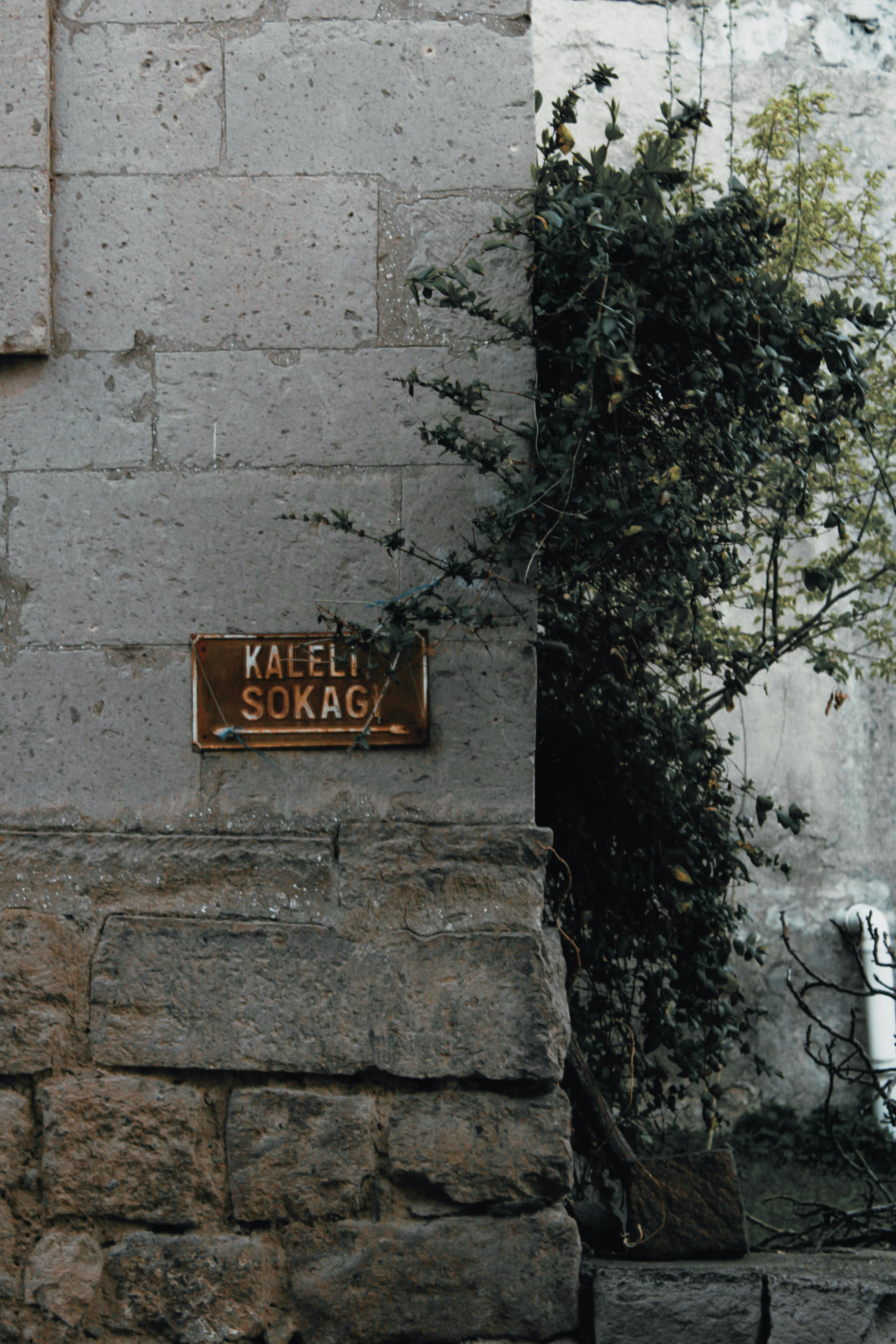 Free A vintage street sign on a stone wall at the corner of Kaleli Sokak. Stock Photo