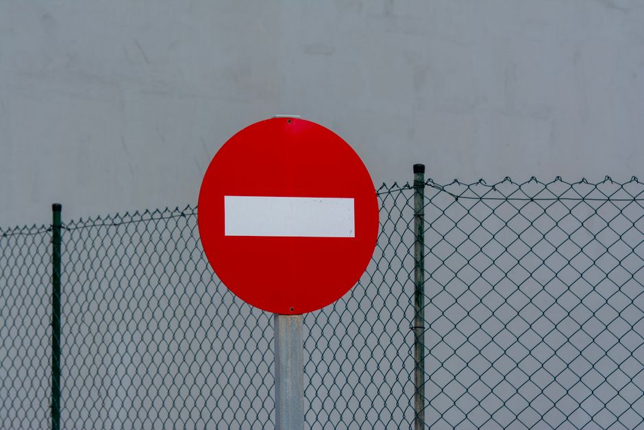 Red no-entry sign — absolute contraindications for iboga and ibogaine include active cardiac conditions, SSRIs, and methadone without a transition protocol