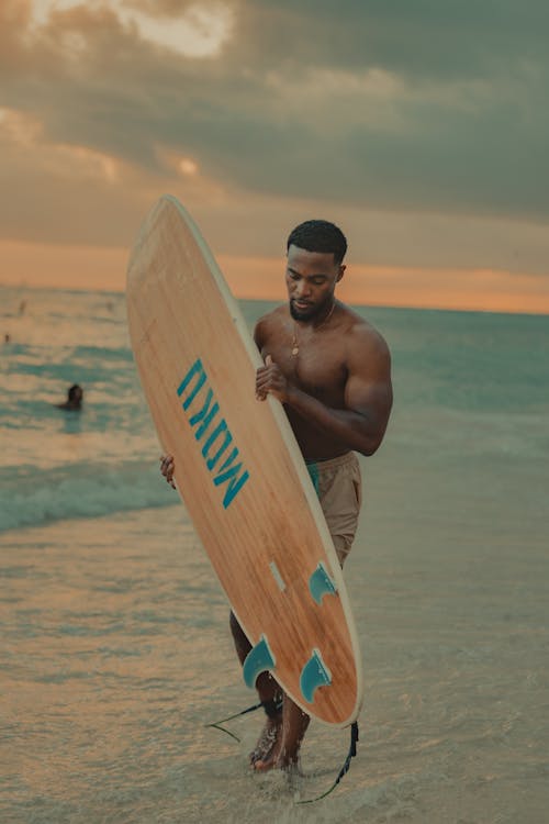 A Man with a Surfing Board