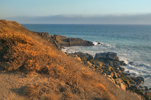 dalgalar, deniz, gün batımı içeren Ücretsiz stok fotoğraf