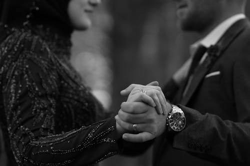 An Engaged Couple Holding Hands