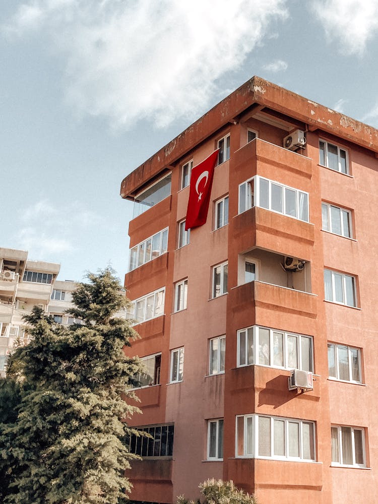 An Apartment Building With A Turkish Flag