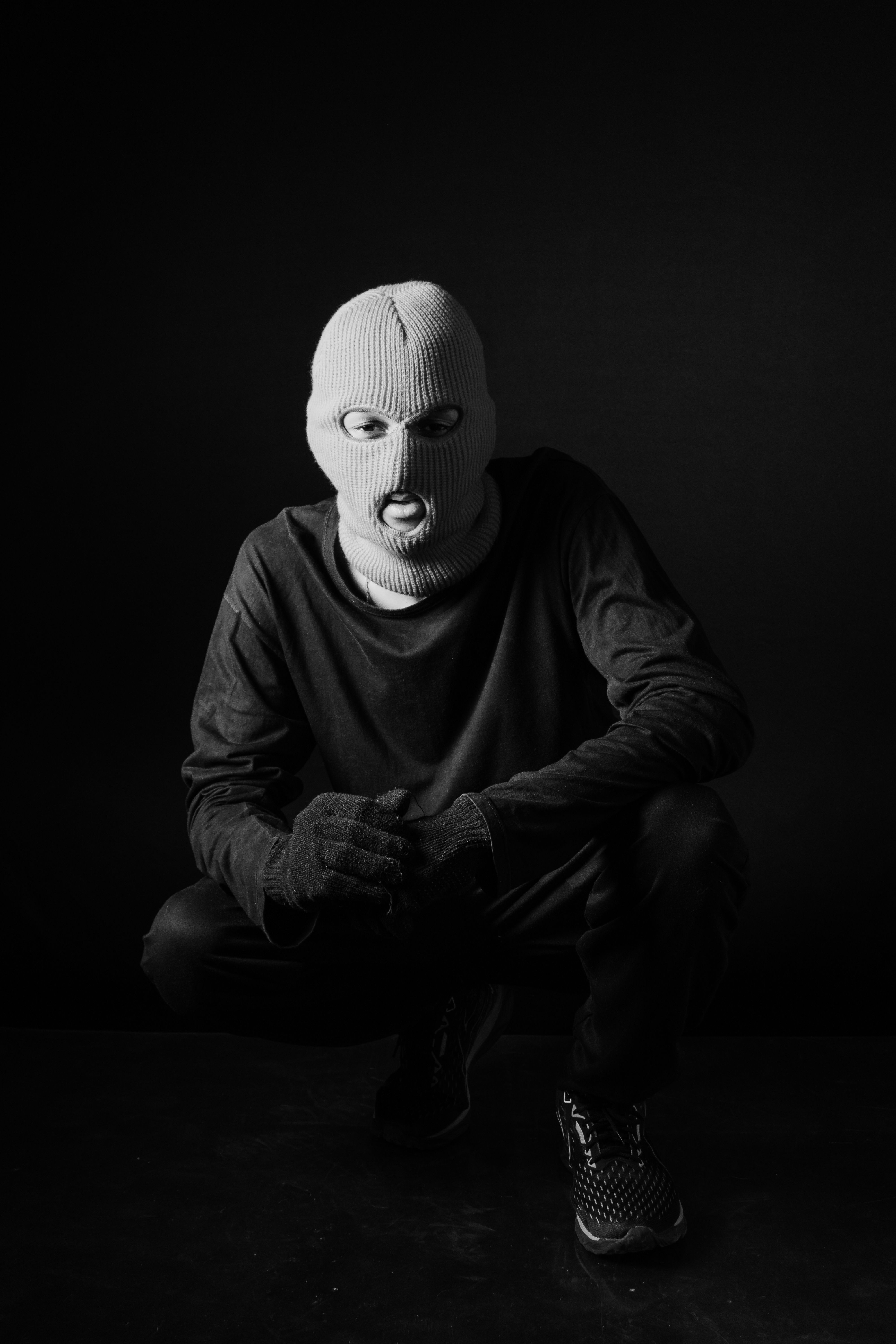 A Man Posing in Mask in Black and White · Free Stock Photo