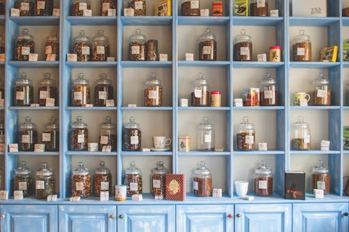 Free Assorted Jars on Blue Shelf Cabinets Stock Photo
