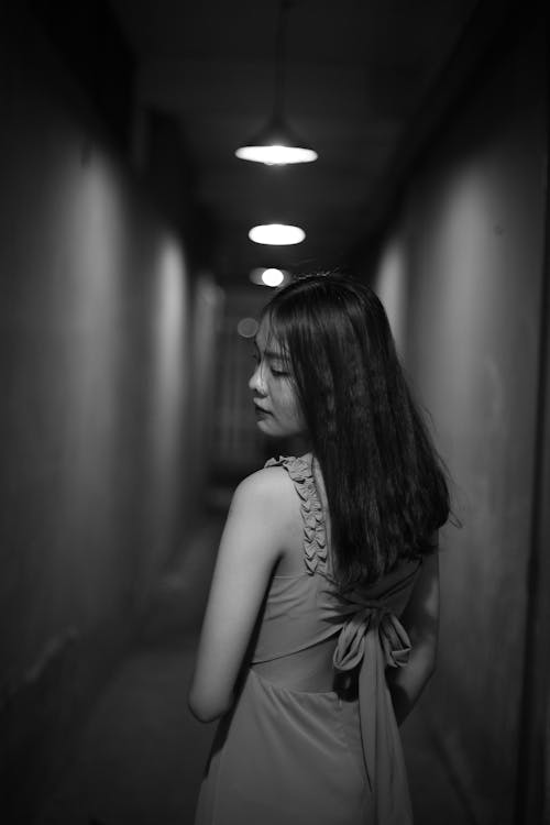 Young Woman in a Long Corridor 