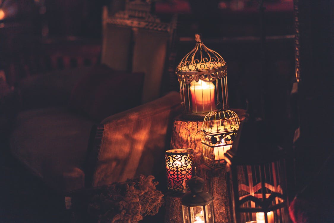 Photo Of Candles Inside Cages