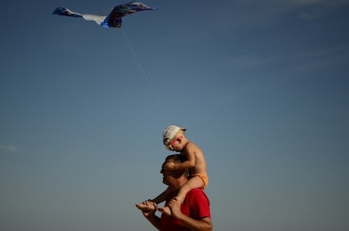 Toddler Boy On Man's Shoulder