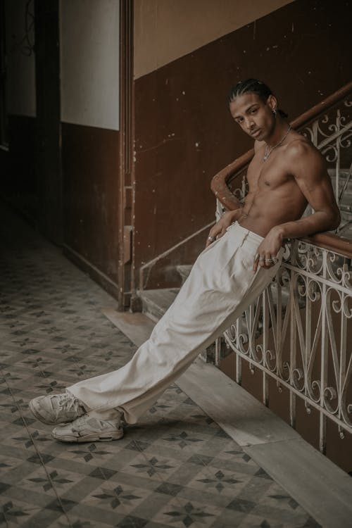 Shirtless Man in Elegant Pants and Sneakers