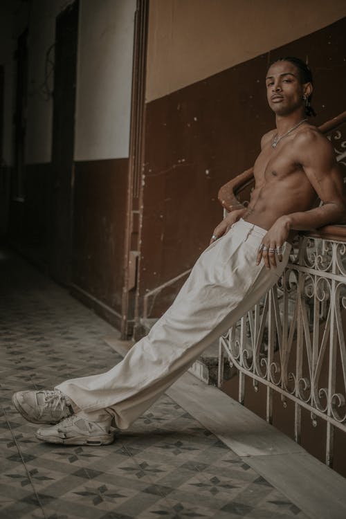 Shirtless Model in Elegant Pants and Sneakers