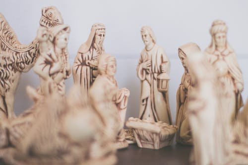 Shallow Focus Photography of Religious Figurines