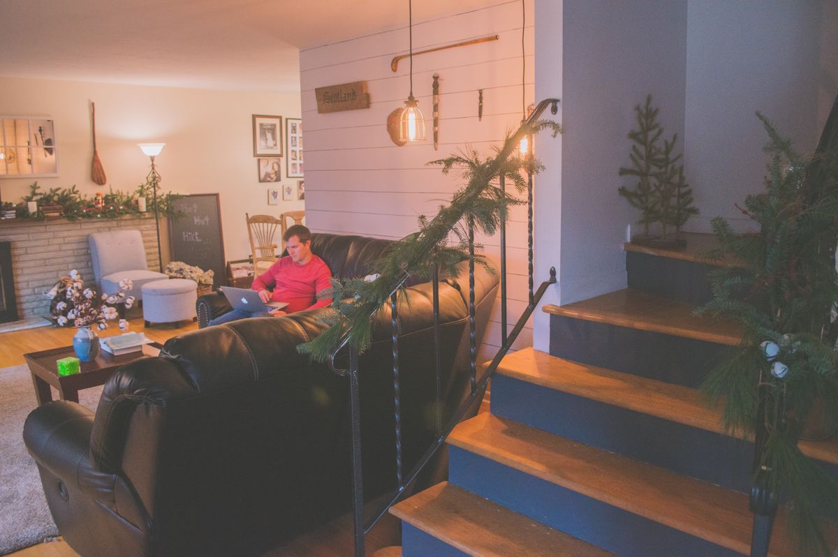 A warm cozy living room in winter with soft light and comfortable furniture